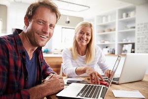 Couple viewing bills at a table